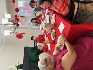 family sitting around table for Chinese New Year