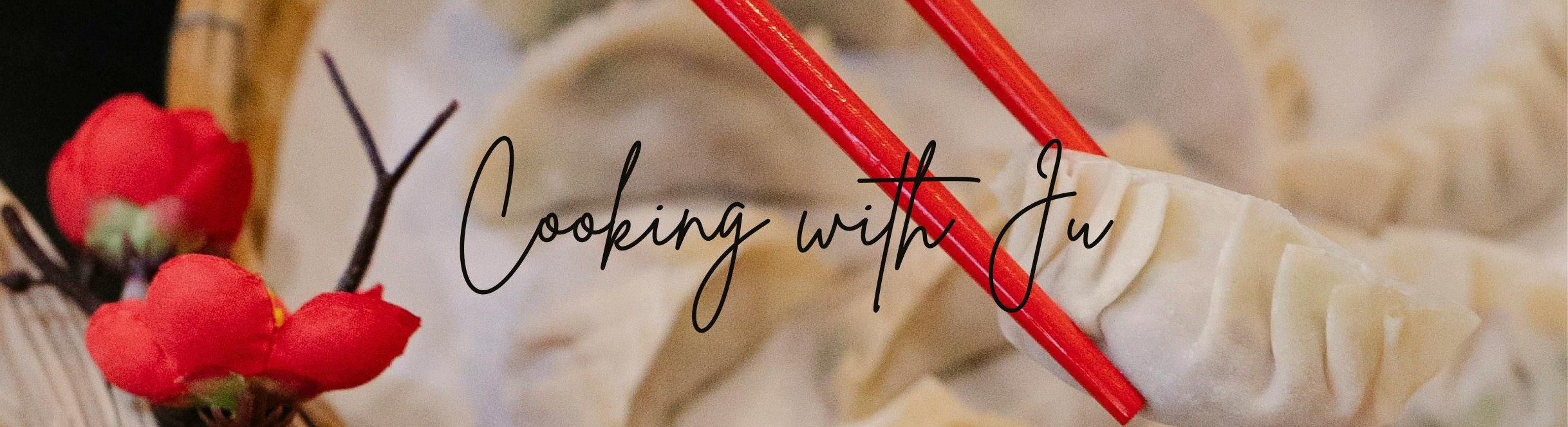 hands holding red chopsticks picking up dumpling